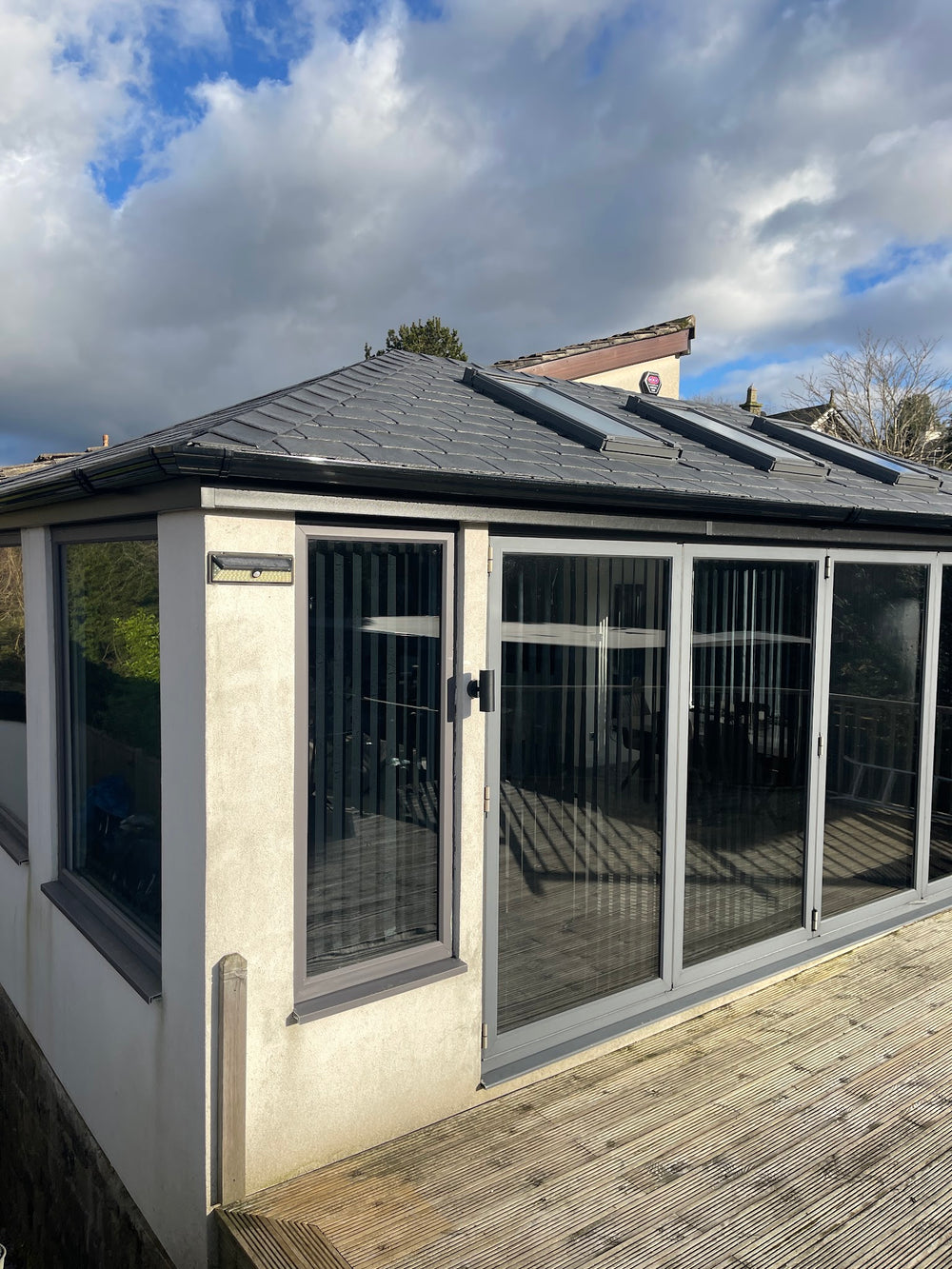 Finished slate roof and rendered walls