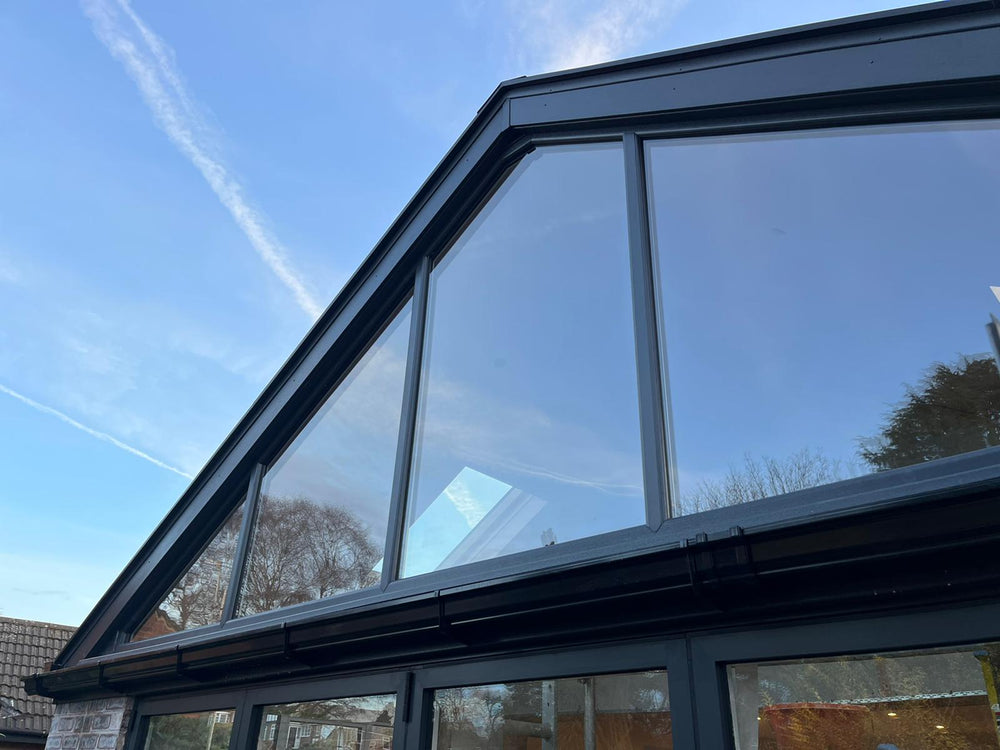 Finished glazed gable with grey frames