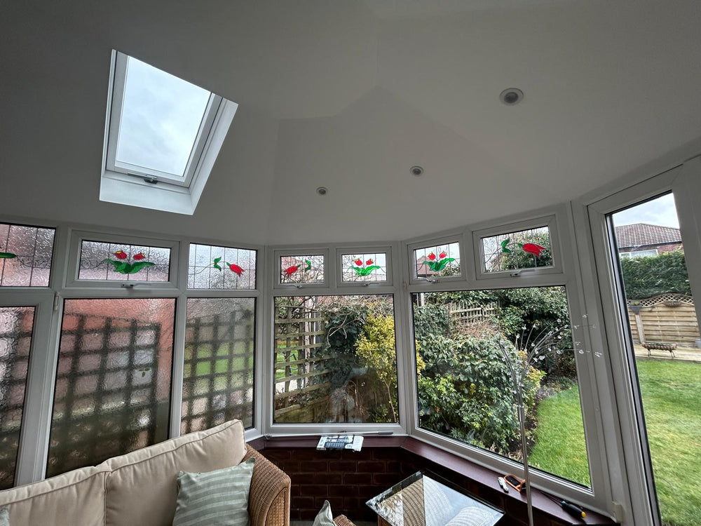 Finished room with rooflight and stained glass