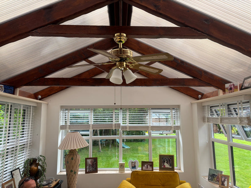 A conservatory before conversion, with the old translucent roof still in place